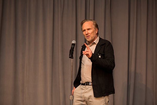SIOE conference photo: Tore reading a poem at the conference dinner.